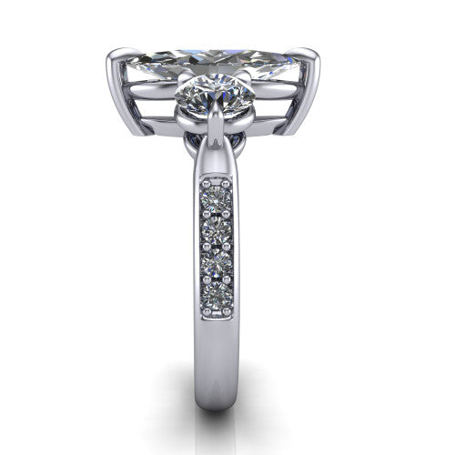 Blake marquise three stone engagement ring in Platinum, side profile showing the round side stone and the pavé diamonds running down the shank