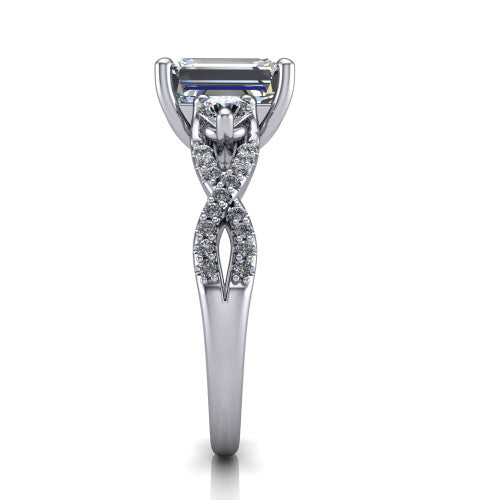 Ryleigh emerald three stone engagement ring in 18K White Gold, side profile showing the twisted pavé infinity band sweeping to the emerald center