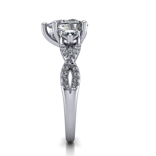 Ryleigh pear three stone engagement ring in 18K White Gold, side profile showing the twisted pavé infinity band sweeping to the pear center