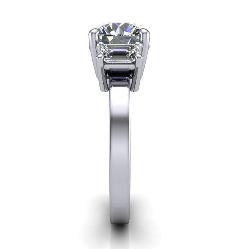 Madelyn round three stone engagement ring in 14K White Gold with emerald-cut side stones, side profile showing the plain band and step-cut side stones