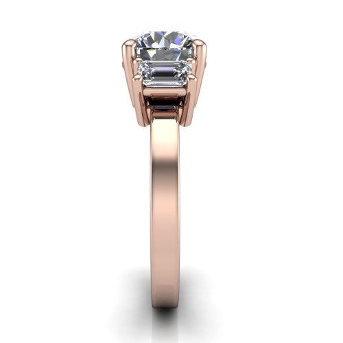 Madelyn round three stone engagement ring in 18K Rose Gold with emerald-cut side stones, side profile showing the plain band and step-cut side stones