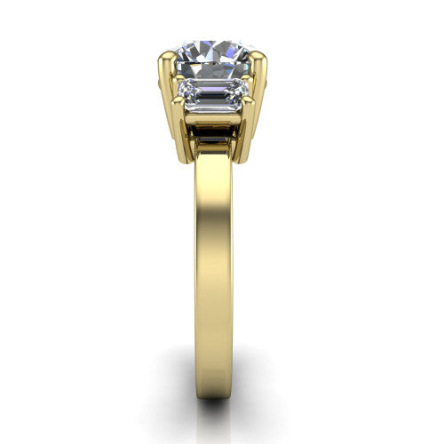 Madelyn round three stone engagement ring in 14K Yellow Gold with emerald-cut side stones, side profile showing the plain band and step-cut side stones