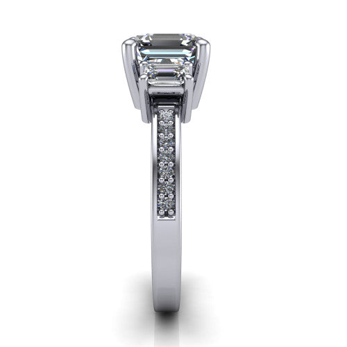 Freya square emerald three stone engagement ring in Platinum, side profile showing the pavé milgrain band and the three-stone setting in profile