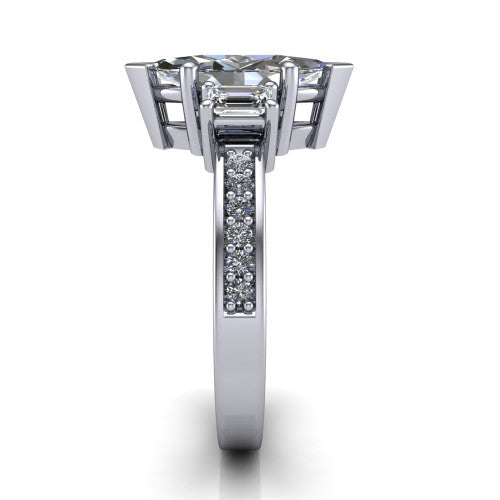 Freya marquise three stone engagement ring in Platinum, side profile showing the pavé milgrain band and the three-stone setting in profile