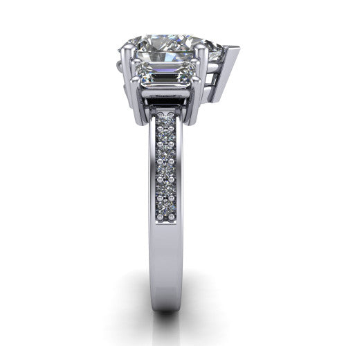 Freya pear three stone engagement ring in Platinum, side profile showing the pavé milgrain band and the three-stone setting in profile