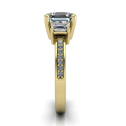 Freya square emerald three stone engagement ring in 18K Yellow Gold, side profile showing the pavé milgrain band and the three-stone setting in profile