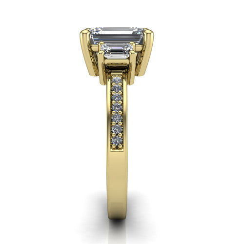 Freya emerald three stone engagement ring in 14K Yellow Gold, side profile showing the pavé milgrain band and the three-stone setting in profile