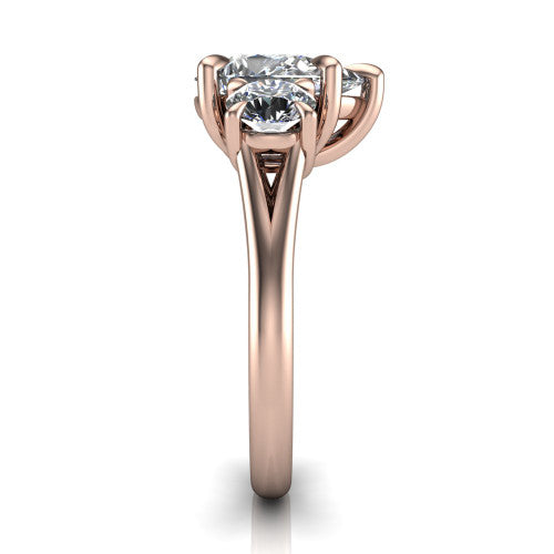 Jasmine pear three stone engagement ring in 18K Rose Gold with round side stones, side profile showing the plain band and split under-gallery
