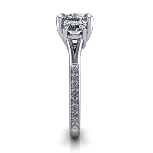Ruth cushion three stone engagement ring in Platinum, side profile showing the pavé band and the three-stone setting in profile