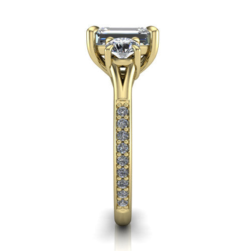 Ruth emerald three stone engagement ring in 18K Yellow Gold, side profile showing the pavé band and the three-stone setting in profile