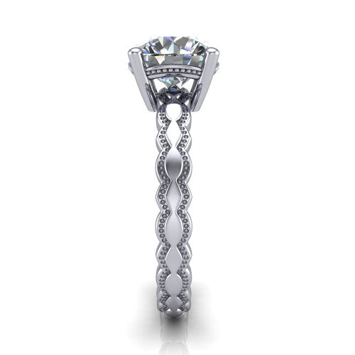 Flora round solitaire engagement ring in 18K White Gold, side profile showing the scalloped milgrain band and the open basket beneath the round center