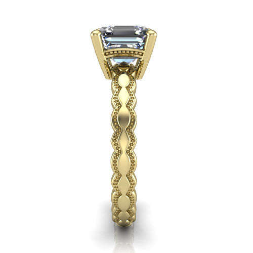 Flora square emerald solitaire engagement ring in 18K Yellow Gold, side profile showing the scalloped milgrain band and the open basket beneath the square emerald center