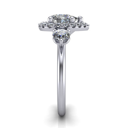 Carol pear three stone halo engagement ring in 18K White Gold, side profile showing the plain polished band and the three-stone halo head in profile