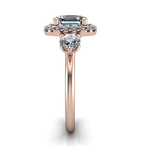 Carol square emerald three stone halo engagement ring in 14K Rose Gold, side profile showing the plain polished band and the three-stone halo head in profile