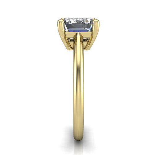Avery emerald classic solitaire engagement ring in 18K Yellow Gold, side profile showing the smooth polished band and the open basket beneath the emerald center
