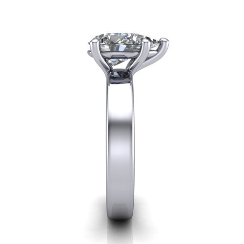 Louise pear classic solitaire engagement ring in 18K White Gold, side profile showing the substantial flat polished band and the open basket beneath the pear center