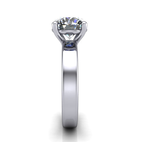 Louise round classic solitaire engagement ring in 18K White Gold, side profile showing the substantial flat polished band and the open basket beneath the round center