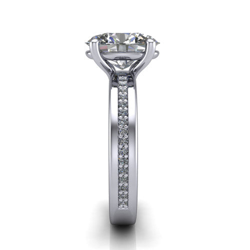 Kamala oval classic solitaire engagement ring in Platinum, side profile showing the wide channel-set pavé band with high-polish edges and the open basket