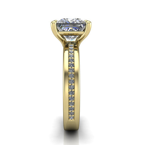 Kamala princess classic solitaire engagement ring in 14K Yellow Gold, side profile showing the wide channel-set pavé band with high-polish edges and the open basket