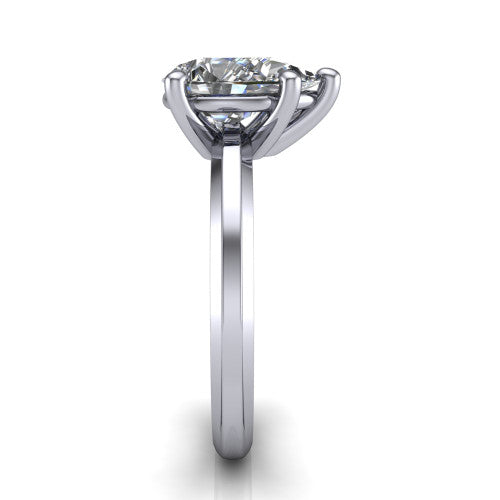 Ellie pear classic solitaire engagement ring in 18K White Gold, side profile showing the substantial knife-edge band and the open basket beneath the pear center