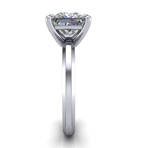 Ellie princess classic solitaire engagement ring in Platinum, side profile showing the substantial knife-edge band and the open basket beneath the princess center