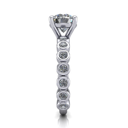 Kinsley round solitaire engagement ring in Platinum with bezel-set diamond accent band, side profile showing the bezel-set diamond shank
