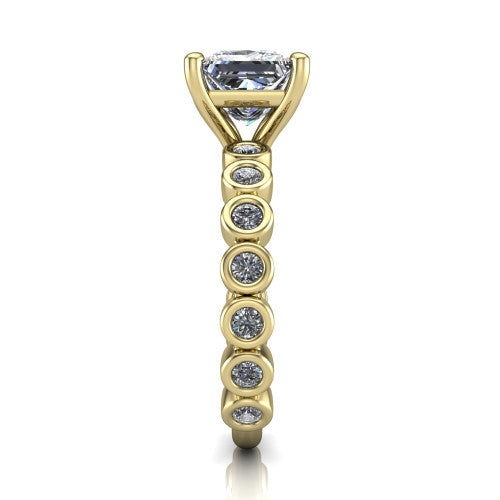 Kinsley princess solitaire engagement ring in 18K Yellow Gold with bezel-set diamond accent band, side profile showing the bezel-set diamond shank