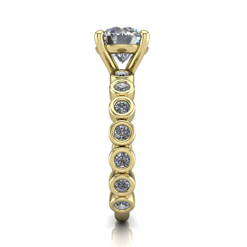 Kinsley round solitaire engagement ring in 14K Yellow Gold with bezel-set diamond accent band, side profile showing the bezel-set diamond shank
