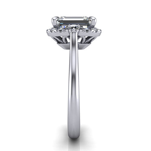Riley emerald halo engagement ring in 14K White Gold with squared pavé halo and round side accents, side profile showing the plain cathedral band and openwork gallery