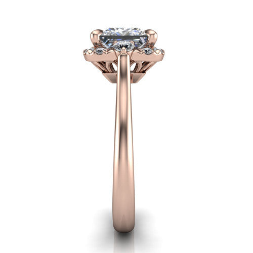 Riley princess halo engagement ring in 18K Rose Gold with squared pavé halo and round side accents, side profile showing the plain cathedral band and openwork gallery
