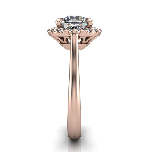Riley round halo engagement ring in 18K Rose Gold with squared pavé halo and round side accents, side profile showing the plain cathedral band and openwork gallery