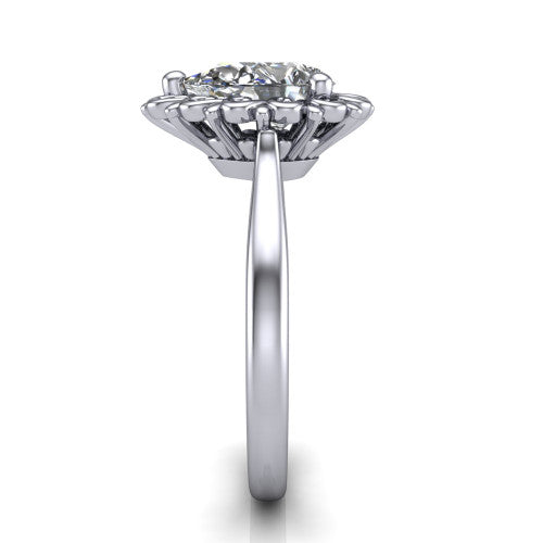 Naomi pear solitaire engagement ring in Platinum with vintage floral filigree frame, side profile showing the plain band and filigree gallery
