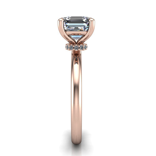 Quinn emerald solitaire engagement ring in 18K Rose Gold with hidden halo and plain band, side profile showing the plain band and hidden halo