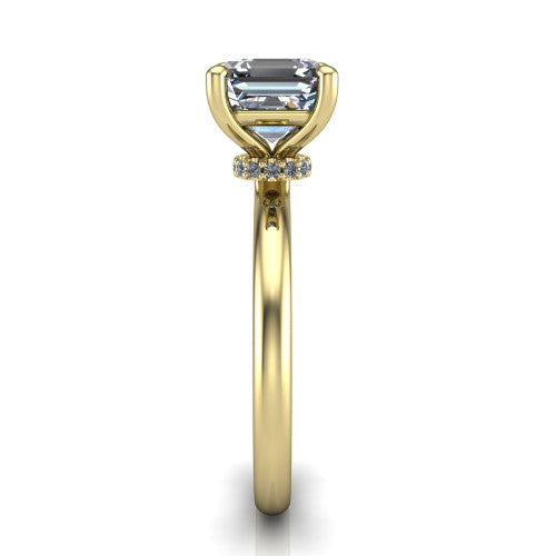 Quinn emerald solitaire engagement ring in 14K Yellow Gold with hidden halo and plain band, side profile showing the plain band and hidden halo