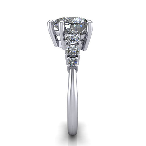 Emery heart accent engagement ring in Platinum with graduated round side stones, side profile showing the graduated side stones and plain band
