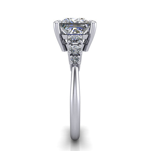 Emery princess accent engagement ring in Platinum with graduated round side stones, side profile showing the graduated side stones and plain band