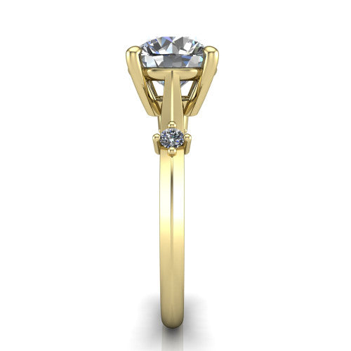 Raelynn round accent engagement ring in 18K Yellow Gold with kite-set geometric side stones, side profile showing the plain band and kite-set side accent