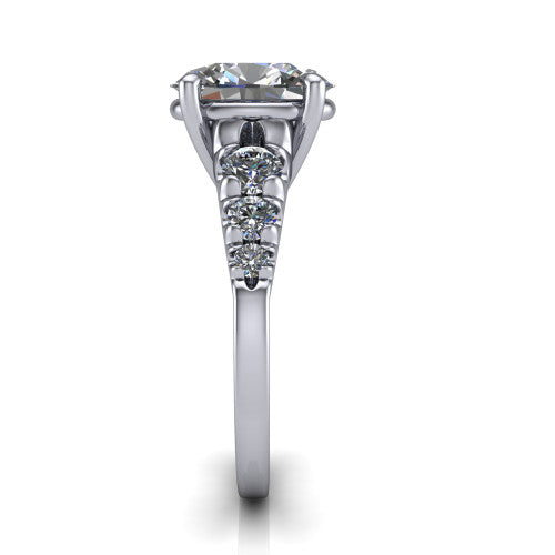 Millie oval accent engagement ring in 18K White Gold with graduated round side stones, side profile showing the graduated side stones and plain band