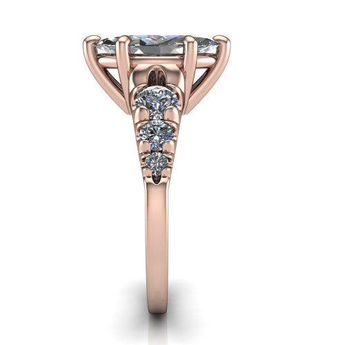 Millie marquise accent engagement ring in 18K Rose Gold with graduated round side stones, side profile showing the graduated side stones and plain band