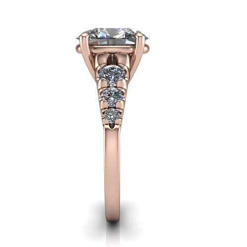 Millie oval accent engagement ring in 18K Rose Gold with graduated round side stones, side profile showing the graduated side stones and plain band
