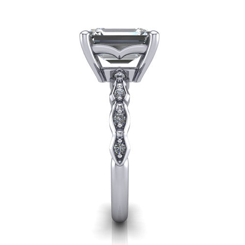 Cassie emerald vintage station engagement ring in 18K White Gold with marquise milgrain band and bezel accents, side profile showing the marquise station band and bezel accents
