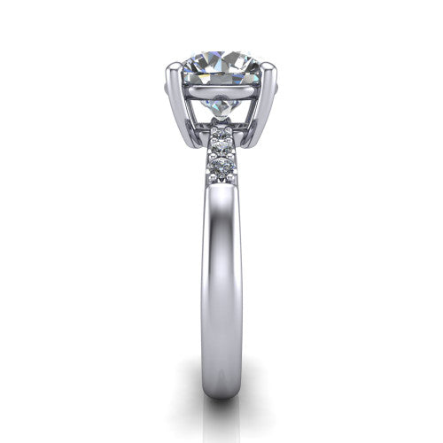 Rebecca round solitaire engagement ring in 14K White Gold with pavé shoulder accents, side profile showing the pavé shoulders and plain band