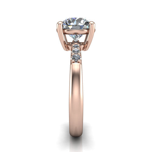 Rebecca round solitaire engagement ring in 18K Rose Gold with pavé shoulder accents, side profile showing the pavé shoulders and plain band