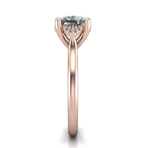 Brianna cushion three stone engagement ring in 18K Rose Gold with milgrain-framed center and round side clusters, side profile showing the plain band and side accent clusters