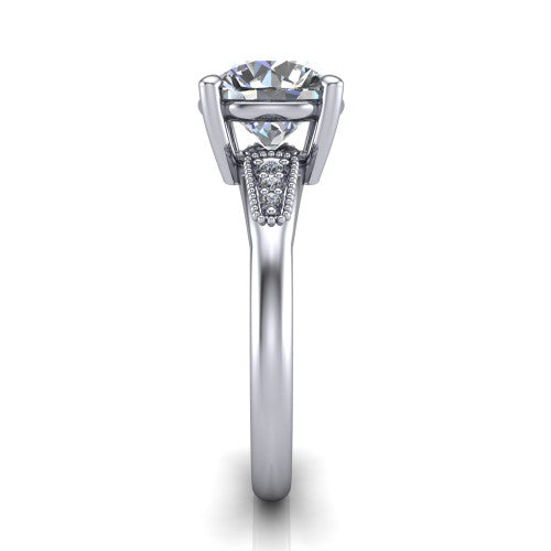 Juliette round pavé solitaire engagement ring in Platinum with milgrain-edged band, side profile showing the tapered milgrain pavé band