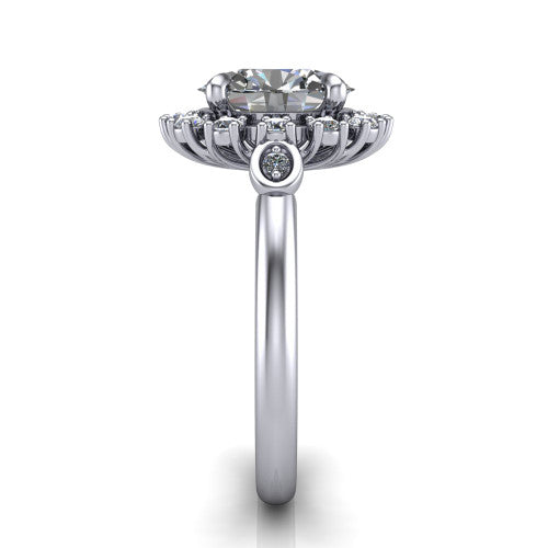 June oval halo engagement ring in Platinum, side profile showing the cluster halo, bezel accents, and slim band in side view