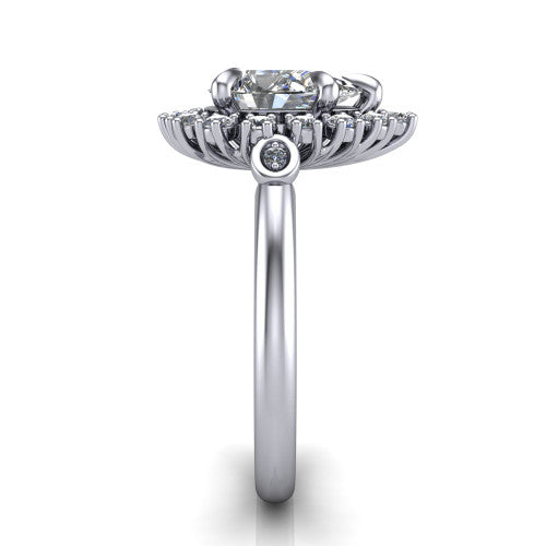 June pear halo engagement ring in Platinum, side profile showing the cluster halo, bezel accents, and slim band in side view