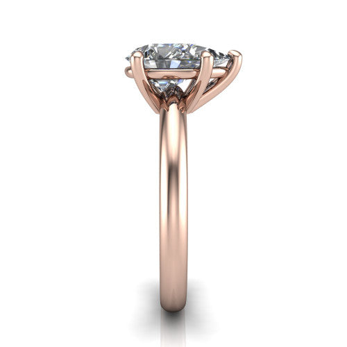 Noelle pear classic solitaire engagement ring in 14K Rose Gold, side profile showing the plain polished band and the prong setting in profile