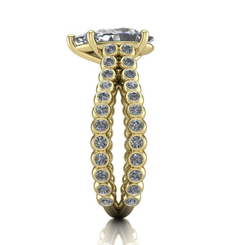 Magnolia pear classic engagement ring in 18K Yellow Gold, side profile showing the split bezel-set diamond band in side view