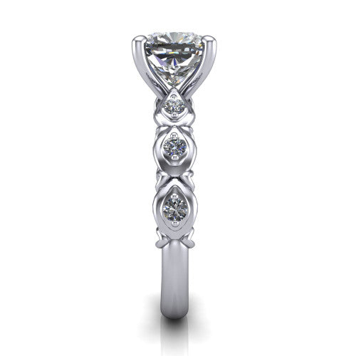 Nyla cushion solitaire engagement ring in Platinum, side profile showing the vintage station band in side view